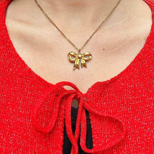 Necklace with bow pendant Gold