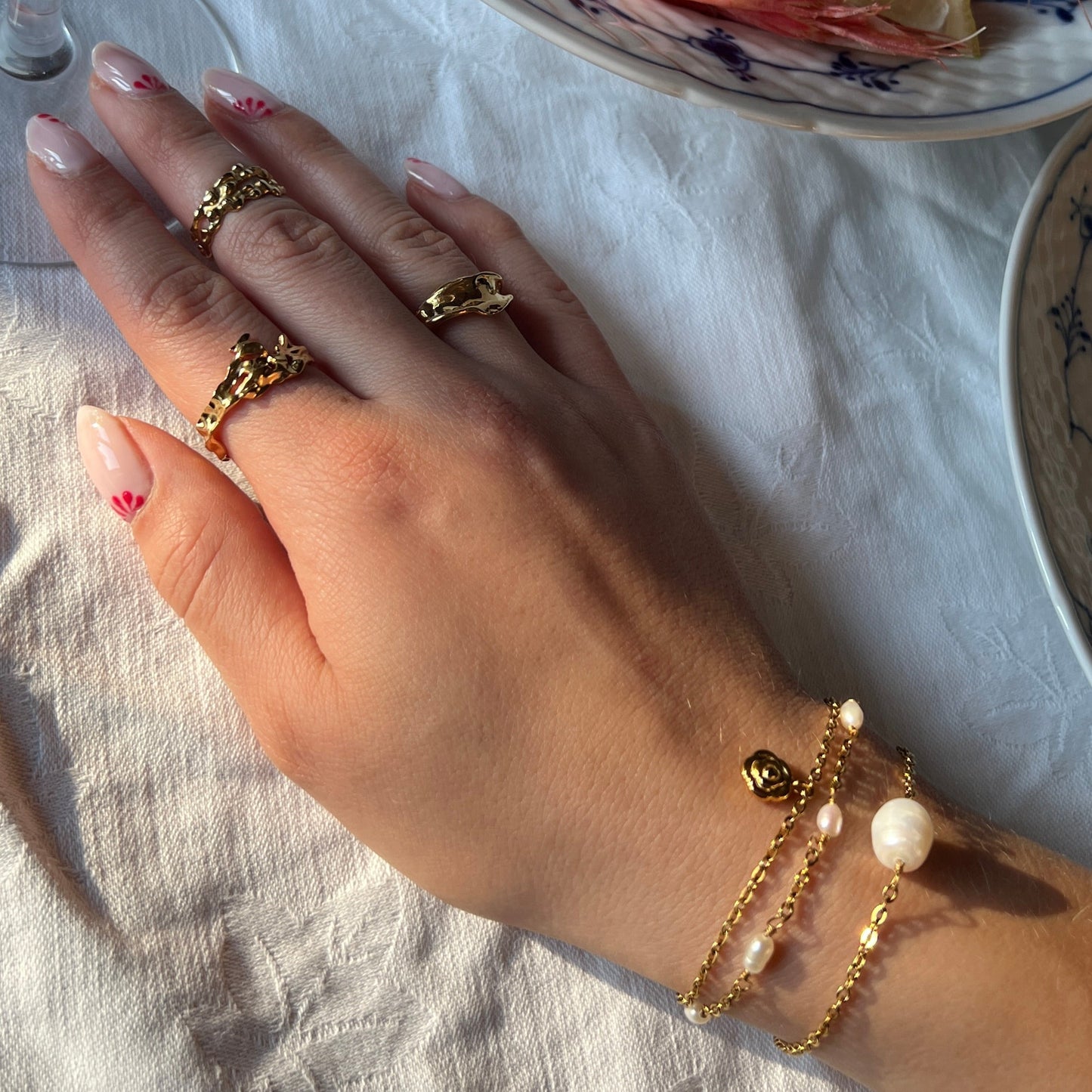 Armbånd med blomst Guld